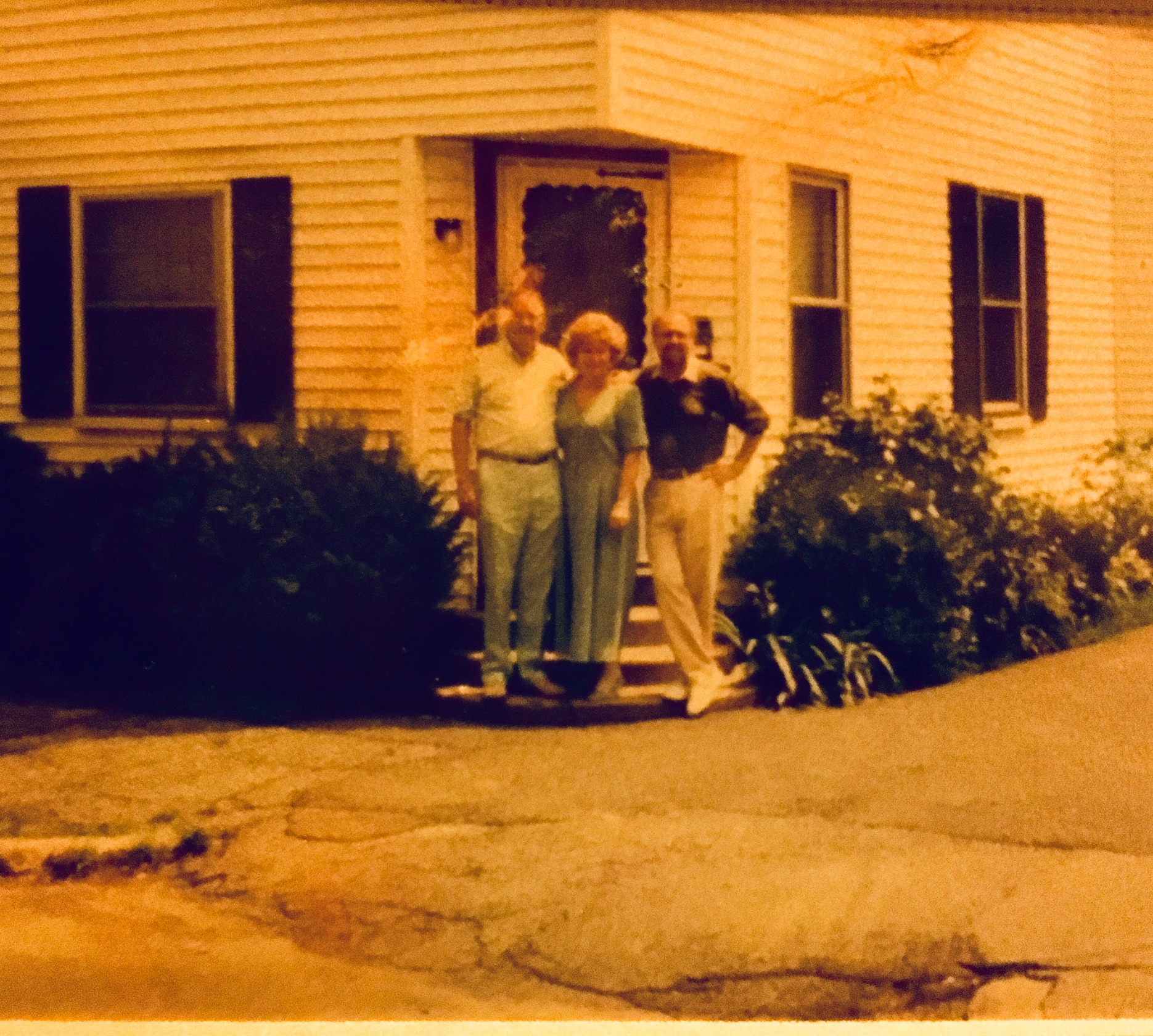 east coast old pic of dad and sibs as adults in doorway
